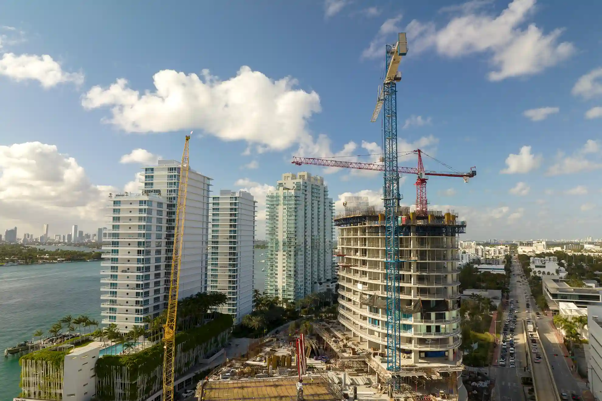 tower lifting cranes high residential apartment building construction site real estate development miami urban area 11zon 1